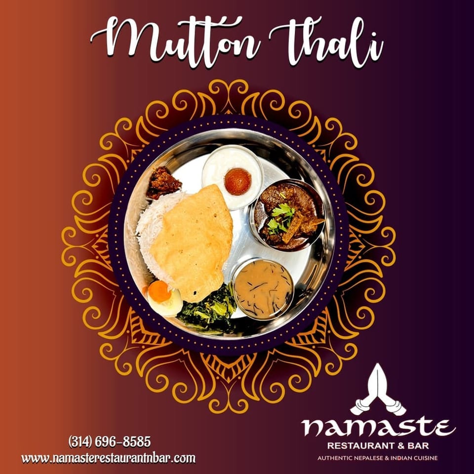 A Namaste Curry Lounge Mutton Thali with rice, curry, papadum, dessert, and vegetables.